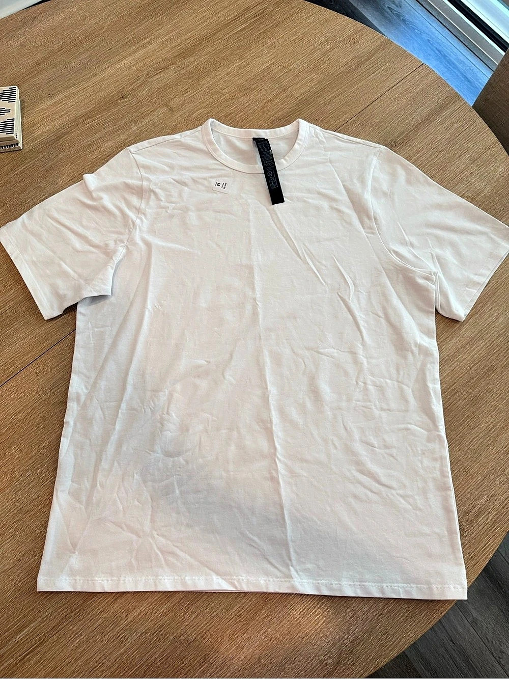 Men’s Lululemon short sleeve T-shirt in white, size Medium